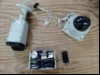 Teile aus Videoüberwachungsanlage / Schließanlage bestehend aus: 2x Kamera, 1x Fernbedienung (mit Klebeband umwickelt), div. Chips und 1 x CES Zylinder ohne Schlüssel, alles verschmutzt und ungeprüft! (ID=V06-03)
